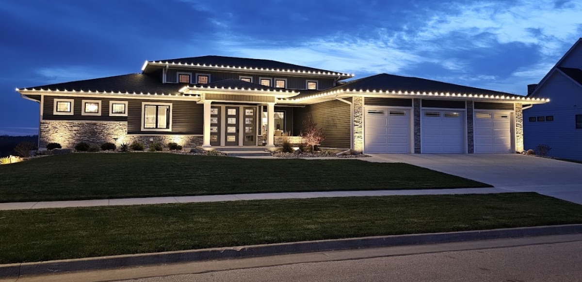 Modern home with clean warm white roofline lighting at dusk